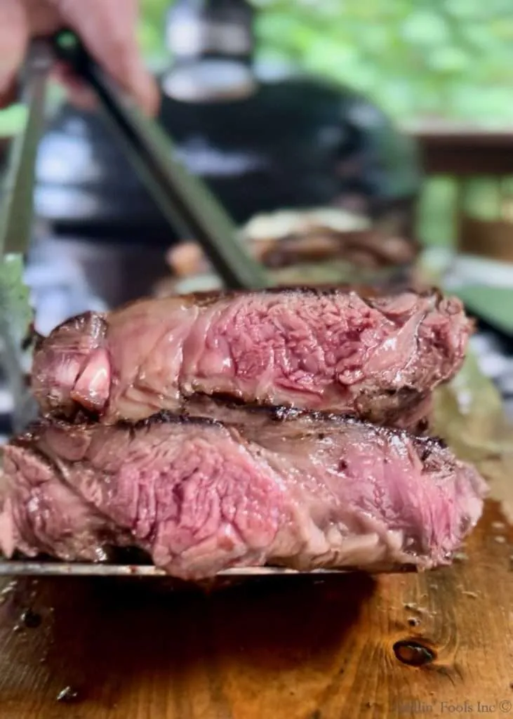 Sliced medium rare ribeye steak